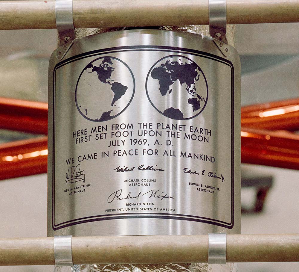 Stainless steel plaque that reads: Here men from the planet Earth first set foot upon the moon. July 1969, A.D. We came in peace for all mankind.